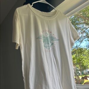 “Let Freedom Ring” Cream Graphic Tee with Teal and Mauve Logo